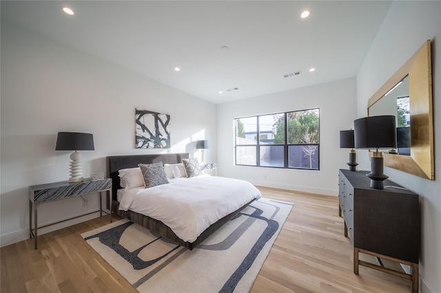 bedroom with light hardwood / wood-style floors