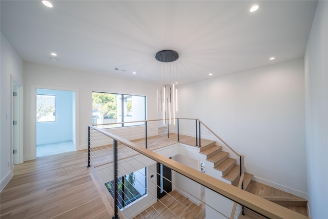 stairs with wood-type flooring