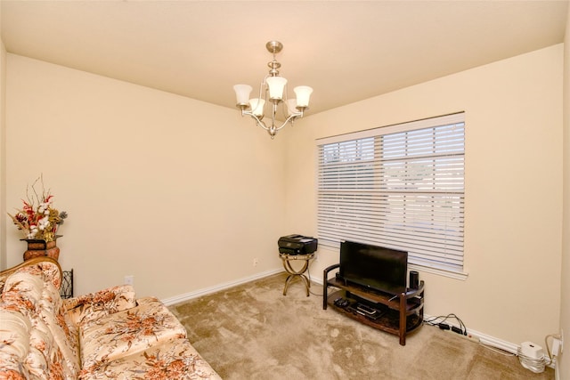 living area featuring carpet floors and an inviting chandelier