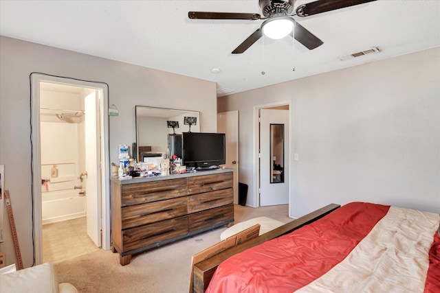 carpeted bedroom featuring connected bathroom and ceiling fan