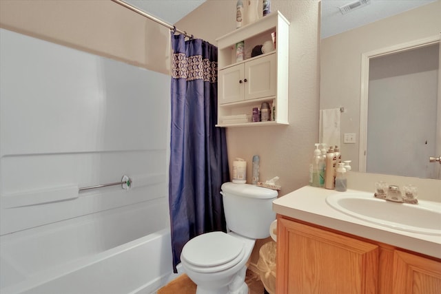 full bathroom with a textured ceiling, vanity, toilet, and shower / bath combo with shower curtain