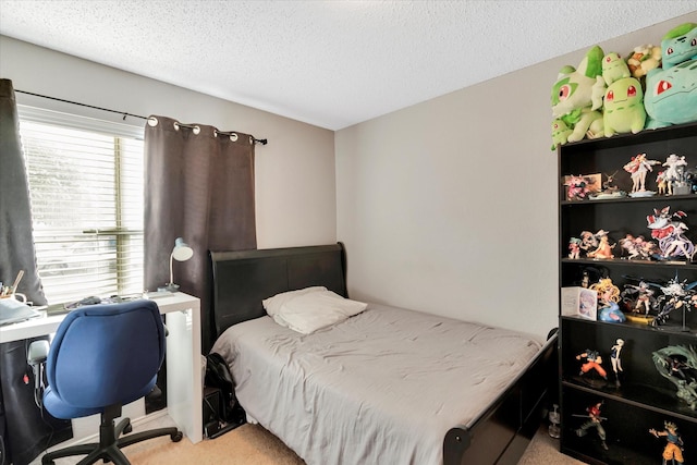 carpeted bedroom featuring a textured ceiling