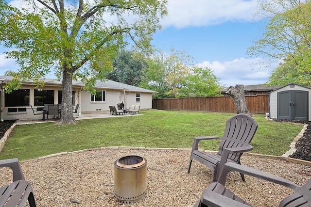 view of yard with a patio and a shed