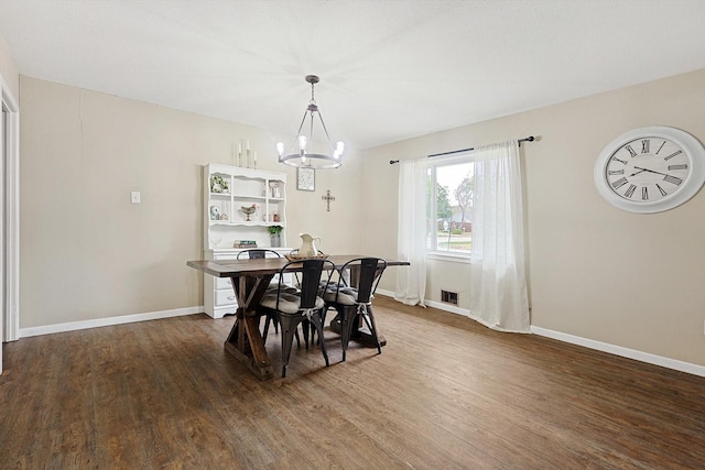 dining area featuring a chandelier and hardwood / wood-style floors