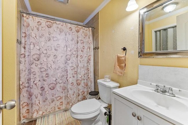 bathroom featuring walk in shower, ornamental molding, toilet, and vanity