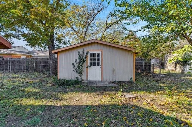 view of outbuilding with an outdoor structure and a fenced backyard