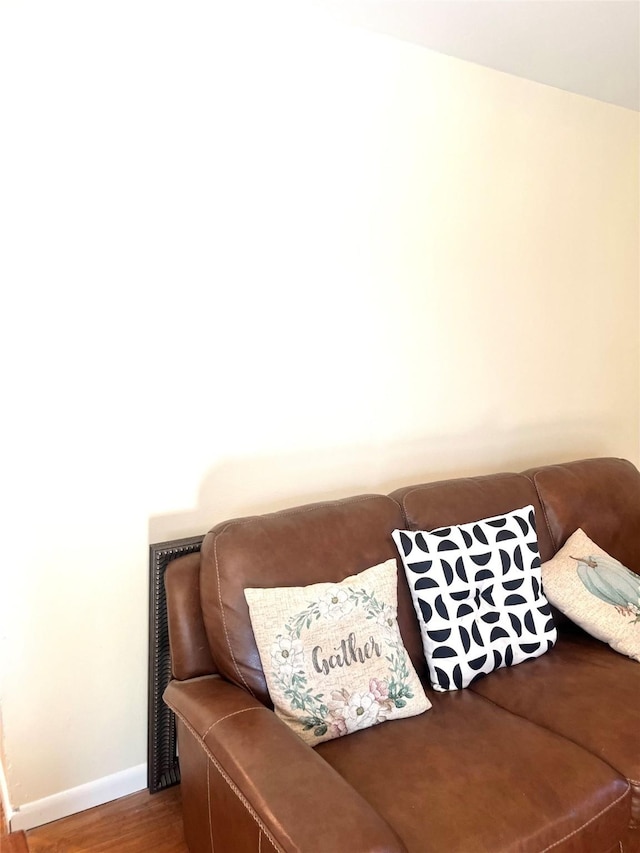 living room featuring wood finished floors and baseboards