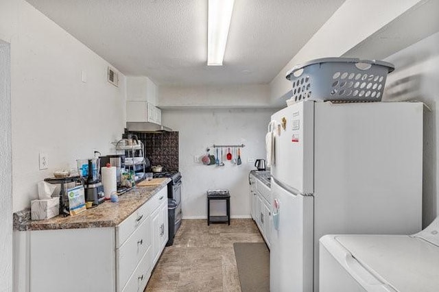 kitchen with white cabinetry, double oven range, washer / clothes dryer, and white fridge