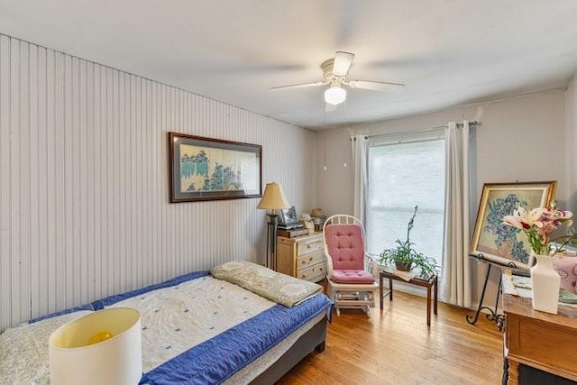 bedroom with ceiling fan and light wood-type flooring