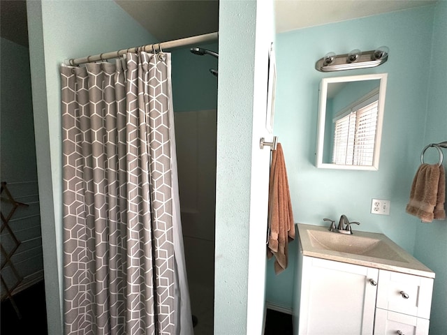 bathroom with a shower with curtain and vanity