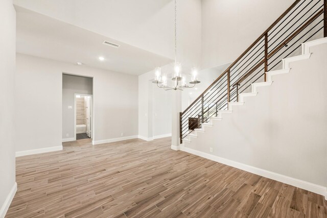 living room featuring beamed ceiling, high vaulted ceiling, a fireplace, and hardwood / wood-style floors