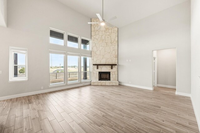 kitchen featuring premium range hood, stainless steel gas cooktop, sink, white cabinetry, and a center island with sink