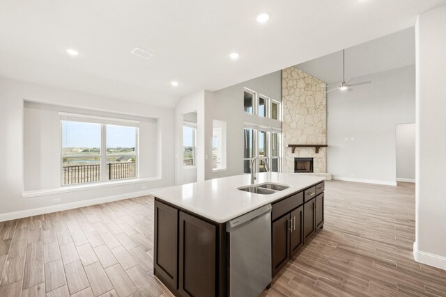 carpeted bedroom with a tray ceiling and ceiling fan