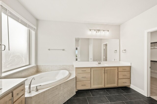 bathroom featuring vanity and separate shower and tub