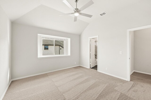 carpeted living room featuring lofted ceiling