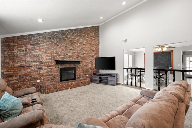 living room featuring crown molding, high vaulted ceiling, a fireplace, and carpet floors