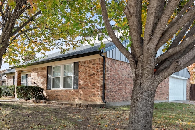 view of side of property featuring a garage