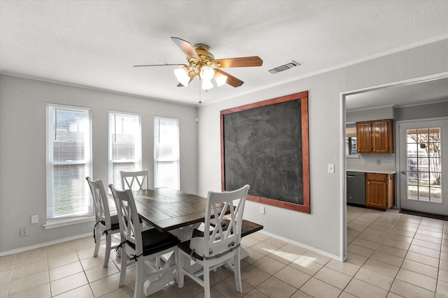 dining space featuring light tile patterned floors, a wealth of natural light, and ceiling fan