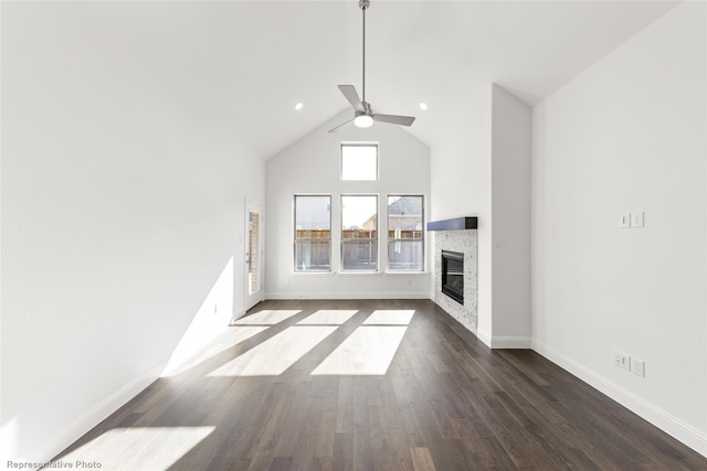 unfurnished living room with high vaulted ceiling, dark hardwood / wood-style floors, and ceiling fan