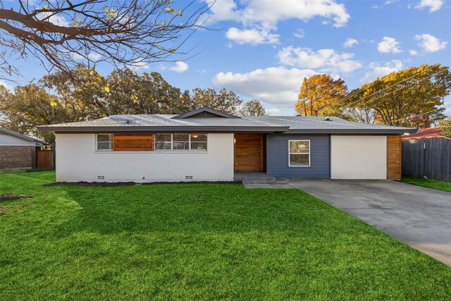 single story home with a garage and a front lawn