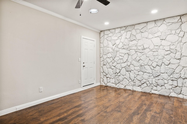 spare room featuring ceiling fan, dark hardwood / wood-style flooring, and ornamental molding