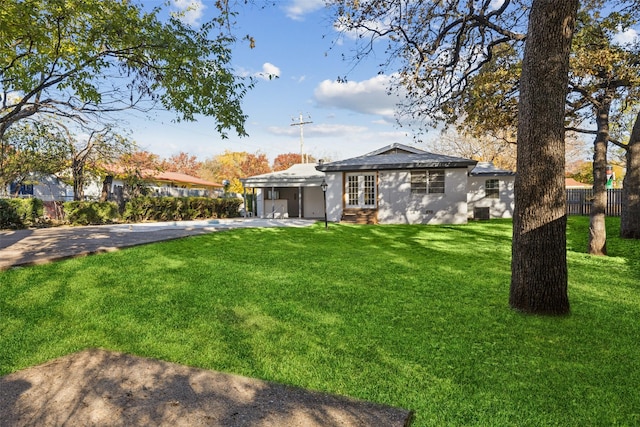 view of yard featuring french doors