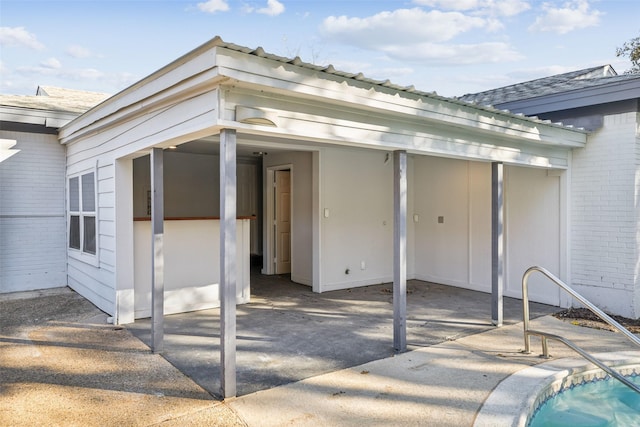 property entrance with a patio