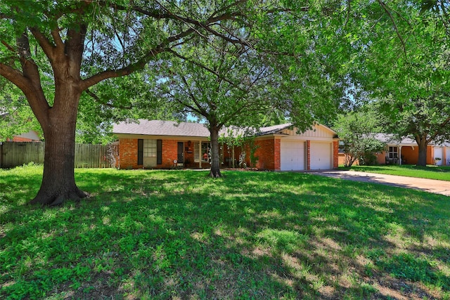 ranch-style home with a garage and a front lawn