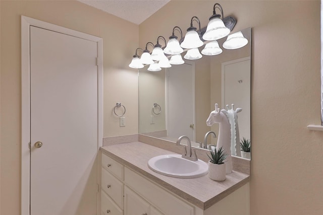 bathroom with vanity and a textured ceiling