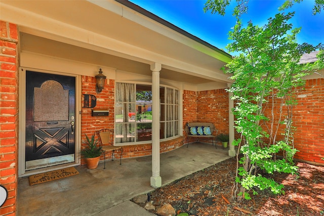 doorway to property featuring a porch