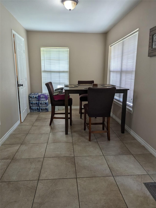 dining space with light tile patterned flooring