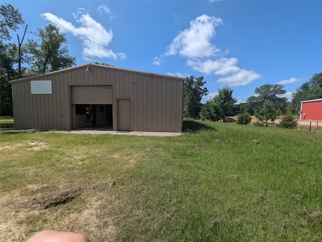 view of outdoor structure with a yard