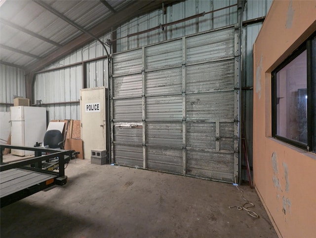 garage featuring white fridge