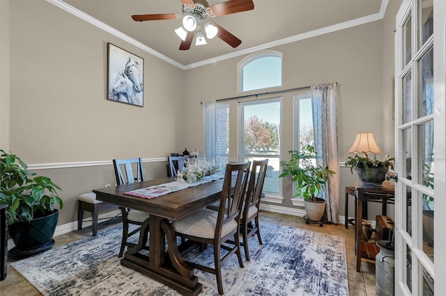 dining area featuring ceiling fan, crown molding, and french doors