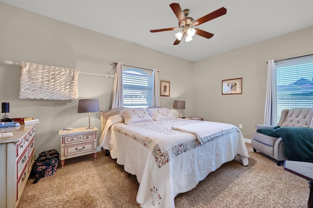 bedroom with light colored carpet and ceiling fan