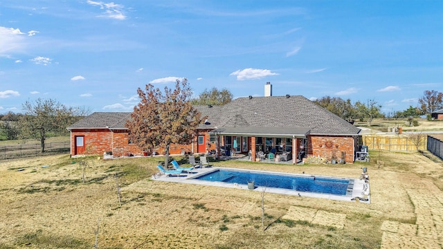 view of pool featuring a yard and a patio