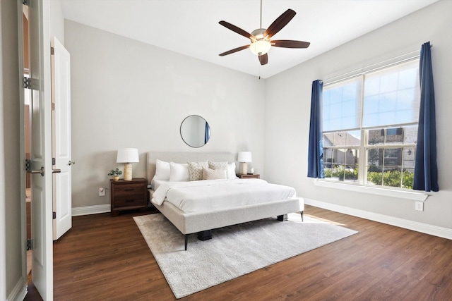 bedroom featuring dark hardwood / wood-style floors and ceiling fan