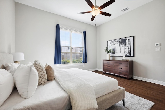 bedroom featuring dark hardwood / wood-style floors and ceiling fan