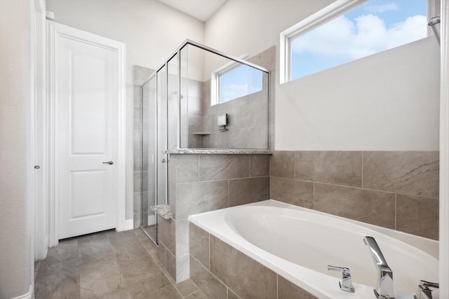 bathroom with shower with separate bathtub