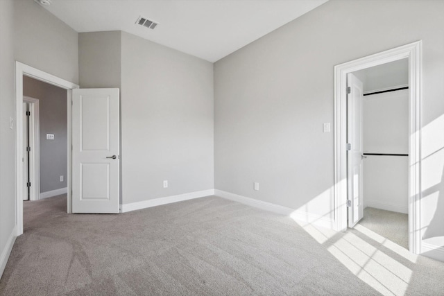 unfurnished bedroom with light colored carpet