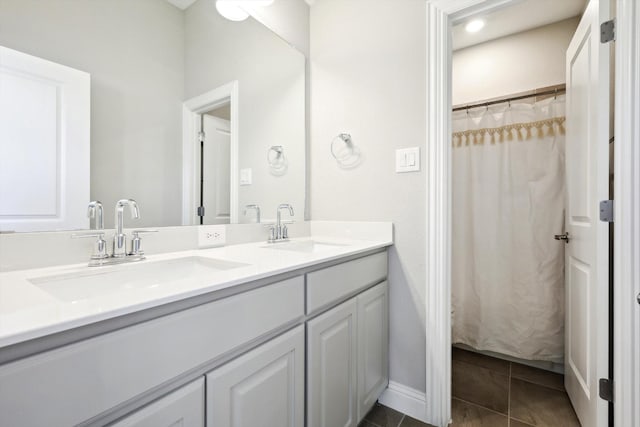 bathroom with vanity, tile patterned floors, and curtained shower