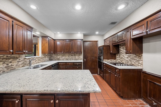 kitchen featuring decorative backsplash, dark brown cabinets, stainless steel appliances, and sink