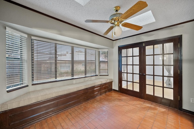 interior space featuring french doors and ceiling fan