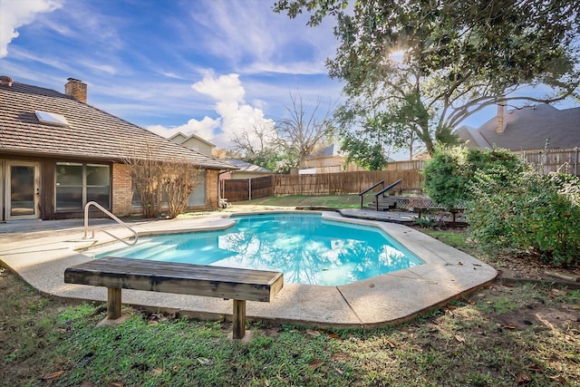 view of swimming pool featuring a patio area