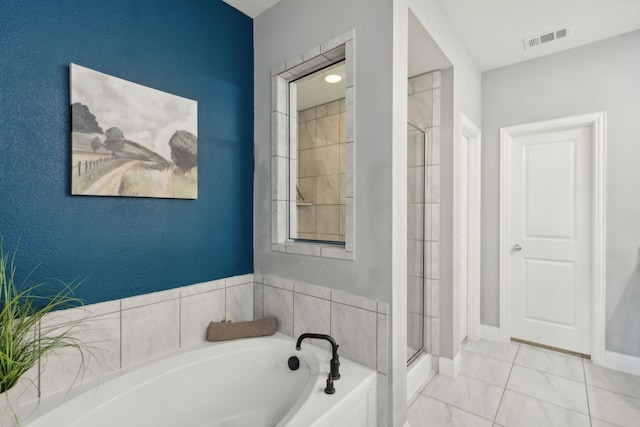 bathroom with shower with separate bathtub