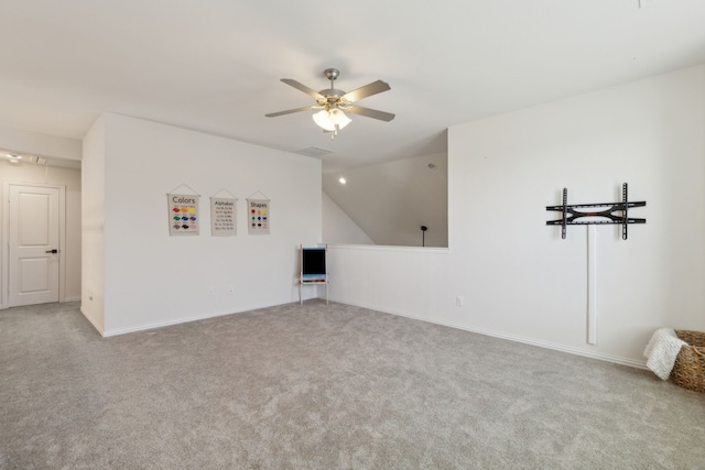 interior space featuring ceiling fan and lofted ceiling