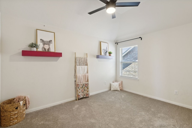 carpeted empty room featuring ceiling fan