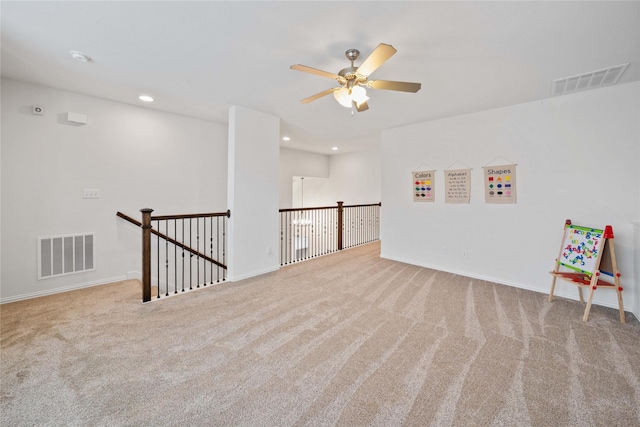 empty room with light carpet, visible vents, and recessed lighting