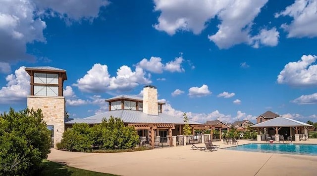 view of swimming pool featuring a patio area