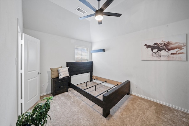 bedroom with carpet floors, baseboards, visible vents, and lofted ceiling